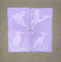 Fused Glass Heron Coasters on Neo Lavender