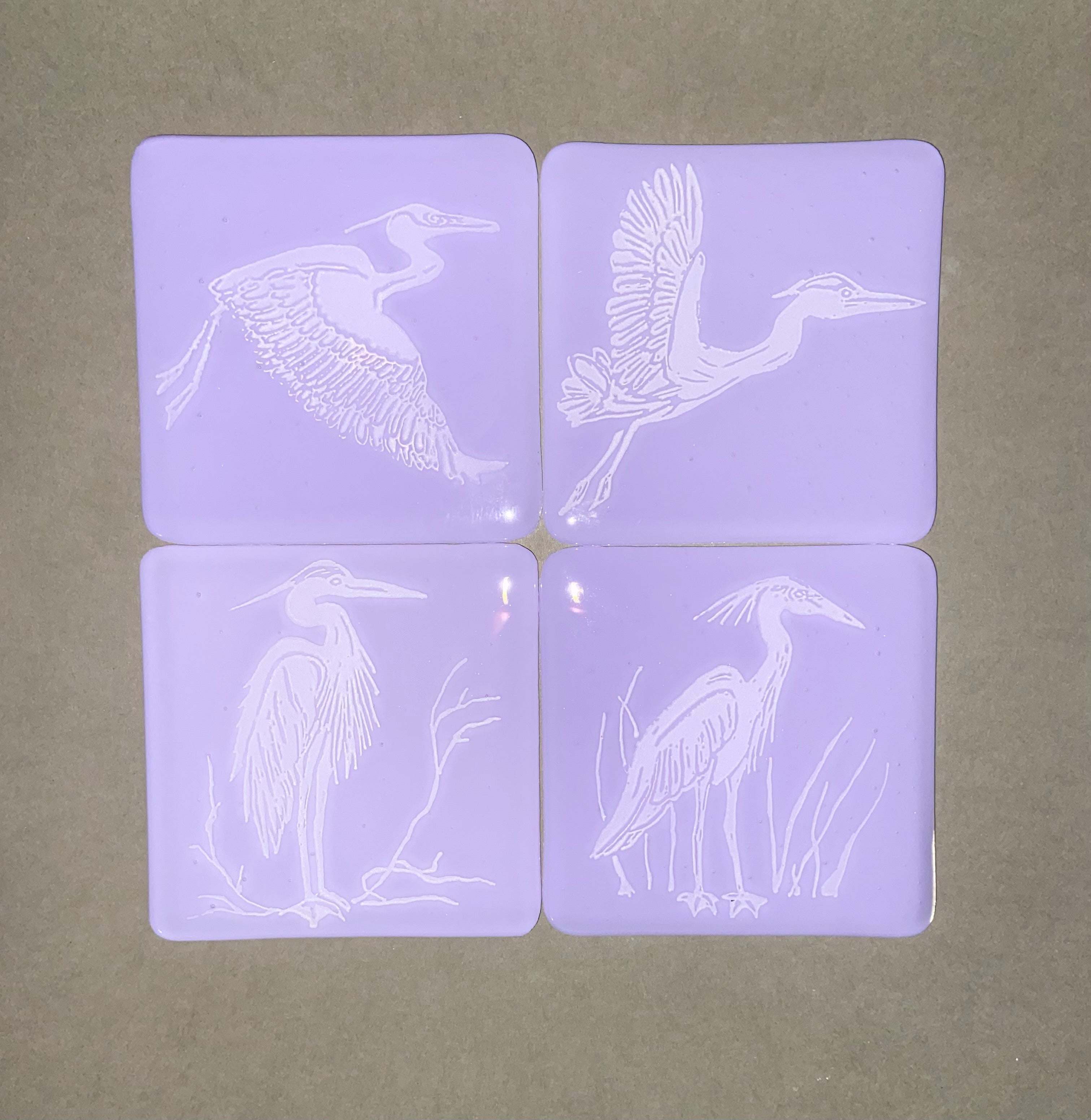 Fused Glass Heron Coasters on Neo Lavender